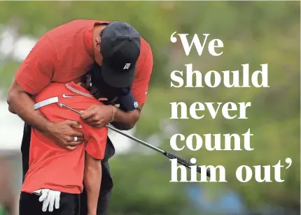  ?? MIKE EHRMANN/GETTY IMAGES ?? The golfing world is showing support for Tiger Woods, shown with his son, Charlie.