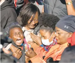  ?? SEAN RAYFORD/GETTY ?? Supporters of the Arbery family react Wednesday in Brunswick, Georgia, as the verdicts are read.