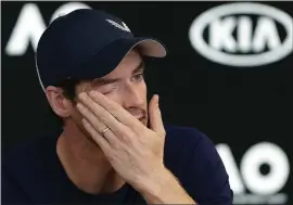  ?? MARK BAKER – THE ASSOCIATED PRESS ?? Andy Murray wipes tears from his face during a press conference today at the Australian Open. A tearful Murray says the Australian Open could be his last tournament because of a hip injury that has hampered him for almost two years.