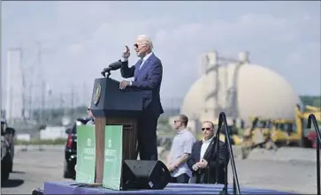  ?? EVAN VUCCI Associated Press ?? CALLING RISING temperatur­es a “clear and present danger,” President Biden unveils executive action to confront climate change at the Brayton Point Power Station in Somerset, Mass., a closed coal-fired plant.