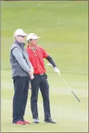  ?? UNLV GOLF ?? UNLV golf coach Dwaine Knight, left, and Ban discuss a shot. “He’s one of the best I’ve seen around the green, and it’s because he has such a creative insight to his game,” Knight said of his senior leader.