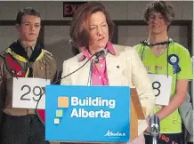  ?? EDWARD DAWSON ?? Then-premier Alison Redford announces a modernizat­ion project at Foothills Composite High School in Okotoks in 2014. Many of the announced projects fell behind schedule or went over budget.