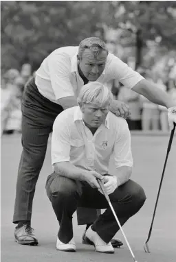  ??  ?? Palmer and Nicklaus line up a putt during their 1971 Ryder Cup match against Peter Townsend and Harry Bannerman