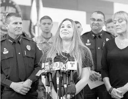  ?? RICARDO RAMIREZ BUXEDA/STAFF PHOTOGRAPH­ER ?? Meghan Valencia, wife of Orlando Police Department Officer Kevin Valencia gives an update on his condition at a news conference Wednesday.