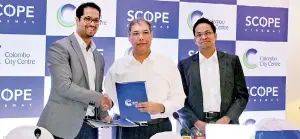  ??  ?? Naveed Cader, Chairman – Scope Cinemas, and Rusi Pestonjee, Director, Abans Group, exchanging the agreement.