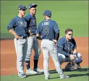  ?? GETTY IMAGES ?? Members of the Tampa Bay Rays infield look on during a pitching change during Game 5 of the ALCS on Thursday.