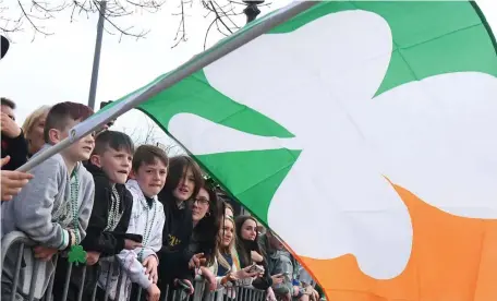  ?? JiM MicHAuD pHOTOS / BOSTON HERALD ?? SHAMROCKED: Kids enjoy the St. Patrick’s Day Parade in Southie on Sunday.