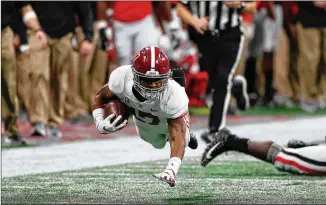  ?? BOB ANDRES/AJC 2018 ?? Wide receiver Jaylen Waddle (shown returning a punt for Alabama against the Bulldogs in the 2018 SEC Championsh­ip game) is projected to be the No. 8 overall pick by the Panthers.