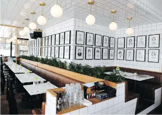  ??  ?? Lining the dining room walls at Foiegwa are dozens of Marc Tremblay sketches of famous Montrealer­s, hung in a style that channels New York’s famous theatre cantine, Sardi’s.