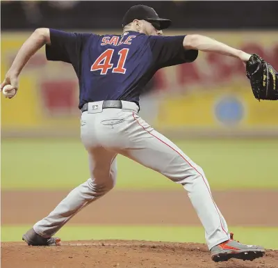  ?? Ap pHOtO ?? NOT LEFT HANGING: Chris Sale allowed four earned runs in 52/3 innings last night, but the Red Sox bats rallied in the ninth to tie, then scored seven in the 15th for a marathon 13-6 victory.