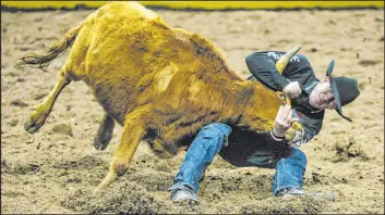  ?? Madeline Carter Las Vegas Review-journal ?? Dalton Massey, in his first go-round at his first National Finals Rodeo, was a winner Friday night at the Thomas & Mack Center.