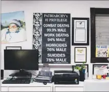  ?? JOHN FRANCIS PETERS / THE NEW YORK TIMES ?? A poster hangs on a wall at the Men’s Legal Center, a law firm in the same building as the National Coalition for Men, in San Diego. The men’s rights activist group frequently sues bars offering ladies’ night discounts, or other businesses making...