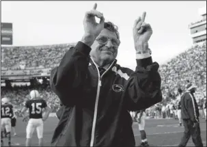  ?? The Associated Press ?? A LEGEND’S FALL: Penn State football coach Joe Paterno acknowledg­es the crowd during warmups before an NCAA college football game against Wisconsin on Nov. 5, 2005, in State College, Pa. “Paterno” aims to tell the polarizing story of a legend’s fall,...