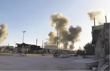  ?? Syrian Civil Defense White Helmets ?? Smoke rises after government air strikes hit in the town of Douma east of the capital of Damascus.