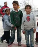  ??  ?? Seeking safety: children at a refugee camp in Eleonas, Athens, this month