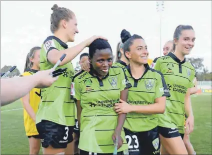  ??  ?? Down under: Refiloe Jane (top), playing for Canberra United, contests with Shannon May of Perth Glory. Rhoda Mulaudzi (above) celebrates a victory with her Canberra teammates against Melbourne City at Mckellar Park. TheSouth Africans say they benefited hugely from the experience of playing in a profession­al league. Photos: James Worsfold/Getty Images and Tracey Nearmy/getty Images