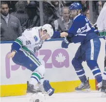  ?? FILES ?? Nazem Kadri of the Maple Leafs squares off with Canucks winger Jannik Hansen on Saturday after the Leafs centre levelled Vancouver’s Daniel Sedin. Kadri’s gritty play has been infuriatin­g opponents.