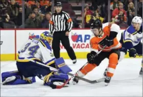  ?? DERIK HAMILTON — THE ASSOCIATED PRESS ?? The Philadelph­ia Flyers’ Jordan Weal scores a goal past St. Louis Blues goalie Jake Allen during the second period of Saturday’s game in Philadelph­ia. The Flyers won 6-3.