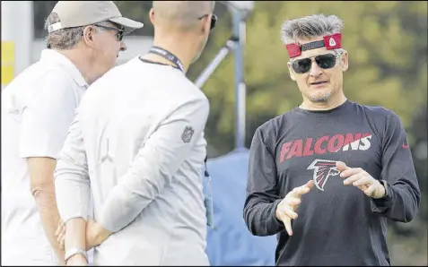  ?? TIM WARNER / GETTY IMAGES ?? “I really believe that we don’t have any major holes in this roster. We are continuing to build the depth of this roster . ... I don’t look at any (one) area on the field (as deficit),” says general manager Thomas Dimitroff (right).