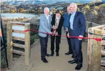  ?? PHOTO: CENTRAL LAKES PHOTOGRAPH­Y/TIM HAWKINS ?? Red ribbon day . . . Sir Eion and Jan Lady Edgar (left), Central Otago Queenstown Trails Trust chairman Stephen Jeffery, and Minster of Tourism Stuart Nash open the Lake Dunstan Cycle and Walking Trail.