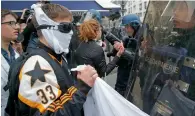  ?? AFP ?? High school children face riot police after protests break out in Paris on the last day of campaignin­g in Paris. —