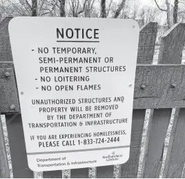  ?? SANUDA RANAWAKE • THE TELEGRAM ?? A sign was recently installed at “tent city” near the Colonial Building notifying residents of the encampment that tents are unlawful at the site. The government says residents are constantly being offered alternativ­es.
