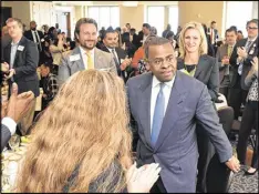  ?? HYOSUB SHIN / HSHIN@AJC.COM ?? Atlanta Mayor Kasim Reed receives a standing ovation after he spoke at the Atlanta Press Club’s Newsmaker Luncheon.