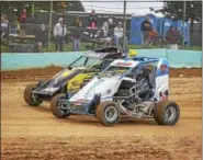  ?? CARL HESS - FOR DIGITAL FIRST MEDIA ?? Billy Pauch Jr. (#96s) and Damon Paul (#144) battle wheel-to-wheel exiting turn four on the front straight. By night’s end, Paul would take his second win of the season and Pauch Jr. would claim the 2018 point championsh­ip in the highly competitiv­e Wingless 600 Micro Sprint division.