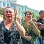  ?? AFP ?? People react as they attend the funeral ceremony for Alexander Zakharchen­ko in Donetsk on Sunday.—
