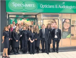  ??  ?? Staff outside the new Specsavers store