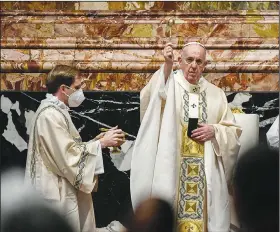  ?? (AP/Filippo Monteforte) ?? Pope Francis celebrates Easter Mass at St. Peter’s Basilica at the Vatican on Sunday during the covid-19 pandemic.