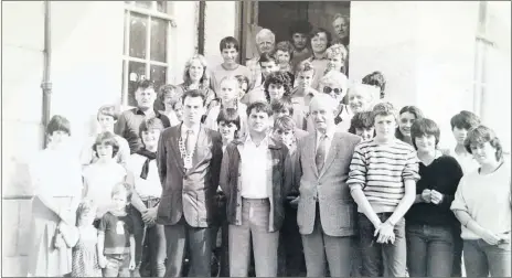  ?? ?? At Fermoy Town Hall in 1983, members of the student exchange, with chairman of Fermoy UDC Tadhg O’Donovan; town clerk, Andy McCarthy and Jean Decours (in front).