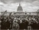  ?? Samuel Corum / TNS ?? Trump supporters gather in front of the Capitol on Jan. 6 before storming the building, leading to five deaths.
