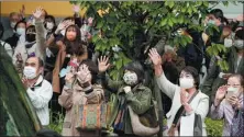  ?? KYODO NEWS VIA GETTY IMAGES ?? A candidate wins support in Kawasaki, Kanagawa Prefecture, on Tuesday, as campaignin­g for the general election gets underway in Japan.