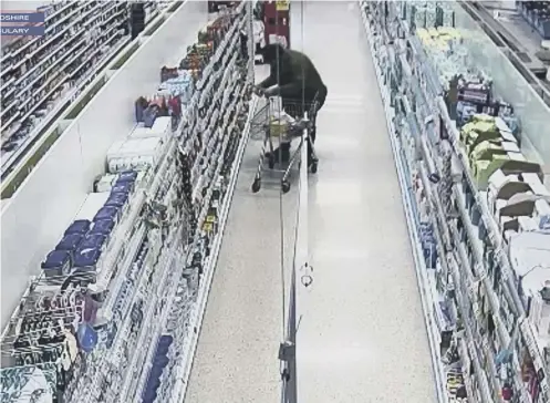  ??  ?? 0 Nigel Wright, top right, was caught on CCTV in the aisle containing baby food in Lockerbie Tesco. A mother from the town found pieces of metal in a jar of Heinz sweet and sour chicken baby food