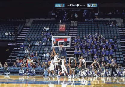  ??  ?? Empty seats line the FedExForum, as the announced crown was 4373 for the Memphis game against Bryant in Memphis Tenn., Saturday, December 9, 2017. MARK WEBER/THE COMMERCIAL APPEAL