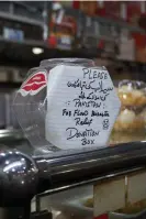  ?? Photograph: Wilfred Chan/The Guardian ?? A donation jar in Lahori Chilli, a popular Punjabi restaurant that has raised thousands of dollars for flood victims in Pakistan.