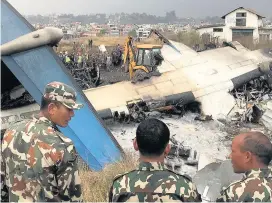  ??  ?? WRECKAGE Soldiers from the Nepalese Army lead the search for survivors