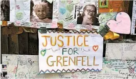  ?? NIKLAS HALLE'N/GETTY-AFP ?? Messages in tribute to the victims of the Grenfell Tower block fire are left Thursday near the scene in west London.