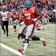  ?? AP/BILL FEIG ?? Offensive lineman Laremy Tunsil, who scored a touchdown during Mississipp­i’s Sugar Bowl victory over Oklahoma State in January, endured a great deal of drama on the first day of the NFL Draft.