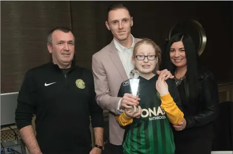  ??  ?? Peter Cherrie receiving the Bray Wanderers player of the year award from supporters Robert Pierce, Jordan Stubbs and Justine Boyle.