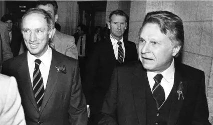  ?? FRED CHARTRAND/THE CANADIAN PRESS ?? Finance Minister Allan MacEachen and Prime Minister Pierre Trudeau in the House of Commons on budget night, Nov 12, 1981. Turmoil over high interest rates was a hallmark of the era.