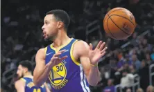  ?? Carlos Osorio / Associated Press ?? Warriors guard Stephen Curry scored 27 points but also had seven turnovers in his first game back from a groin injury.