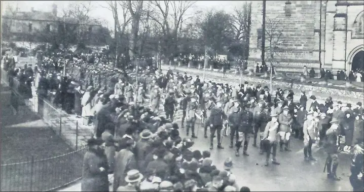  ??  ?? ■ A remembranc­e parade outside All Saints Parish Church, possibly 1920s or 1930s. Loughborou­gh Echo Looking Back archive photos
