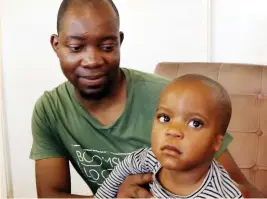  ??  ?? Mr Simba Manhingi with his son