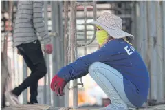  ?? TAWATCHAI KEMGUMNERD ?? A worker takes a break at a constructi­on site in Nonthaburi.