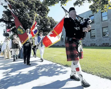  ?? CLIFFORD SKARSTEDT/EXAMINER FILE PHOTO ?? Piper Dennis Wilson leads a procession during the annual United Empire Loyalists flag raising ceremony on June 19, 2013 outside City Hall in Peterborou­gh.