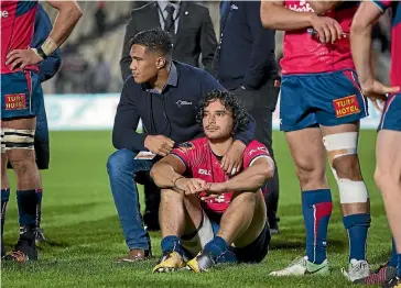  ?? JOSEPH JOHNSON/STUFF ?? Departing Tasman Makos winger James Lowe is consoled by team-mate Tima Faingaanuk­u following Saturday’s final loss to Canterbury.