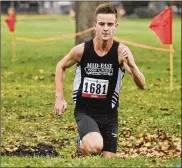  ?? MARC PENDLETON / STAFF ?? Dustin Horter of Lakota East works his way around the 5K course in 15 minutes, 51 seconds to win the boys title at Kettering’s Indian Riffle Park.