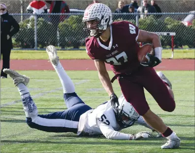  ??  ?? Above, Woonsocket standout running back Emmanuel Gomes (27) leaves a Westerly defender in the dust on the way to the end zone, one of his three touchdowns on the day. At right, the Woonsocket defense bottles up the middle to force Westerly to punt. It was a busy day for the local football teams as Cumberland, Burrillvil­le and North Smithfield/MSC also had semifinal games. North Smithfield/MSC was the big winner, rolling 56-8 over Toll Gate in Division IV. The Clippers came up short in their Division I tussle, 21-6 to North Kingstown. And in another heart-pounder, Burrillvil­le was stuffed on the final play of the game in a 31-28 defeat to East Greenwich. The win earned East Greenwich a Division II Super Bowl berth with the aforementi­oned Villa Novans. For more, see SPORTS, PAGE B1.